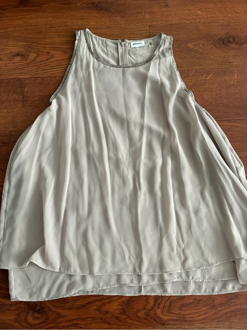 DKNY sleeveless chiffon blouse with a beaded neckline